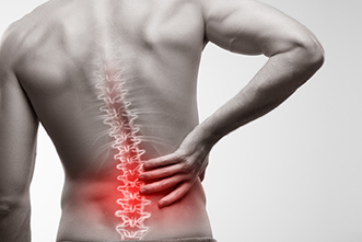 Person comforts their lower back