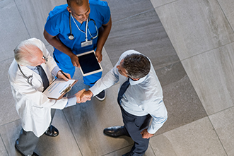 Medical professionals shake hands 